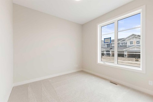 59 Agate Road, Cochrane, AB - Indoor Photo Showing Other Room