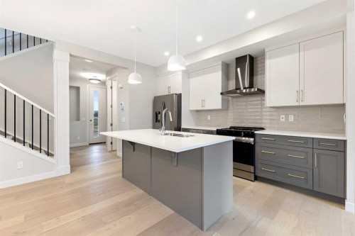 59 Agate Road, Cochrane, AB - Indoor Photo Showing Kitchen With Upgraded Kitchen