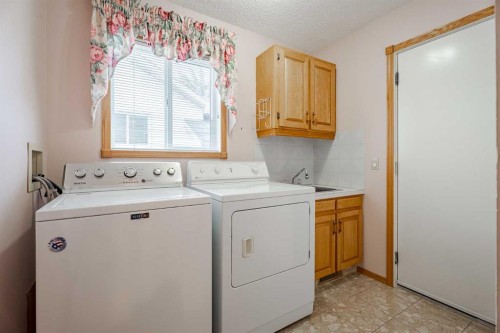 301 Riverview Green, Cochrane, AB - Indoor Photo Showing Laundry Room