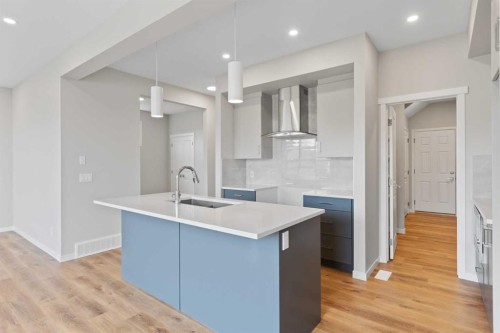 106 Monterey Bay Se, High River, AB - Indoor Photo Showing Kitchen With Double Sink With Upgraded Kitchen