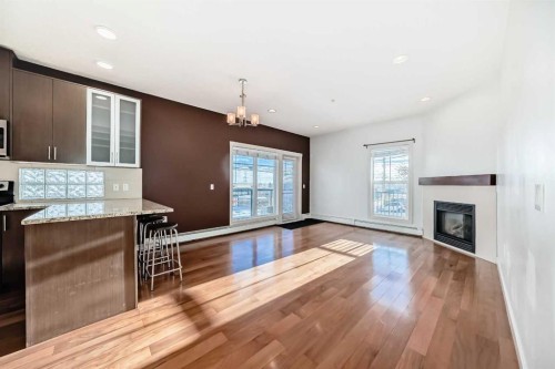 103-4704 Stanley Road Sw, Calgary, AB - Indoor With Fireplace