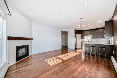 103-4704 Stanley Road Sw, Calgary, AB - Indoor With Fireplace
