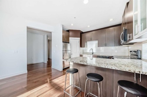 103-4704 Stanley Road Sw, Calgary, AB - Indoor Photo Showing Kitchen With Upgraded Kitchen