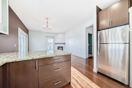 103-4704 Stanley Road Sw, Calgary, AB - Indoor Photo Showing Kitchen With Stainless Steel Kitchen With Upgraded Kitchen