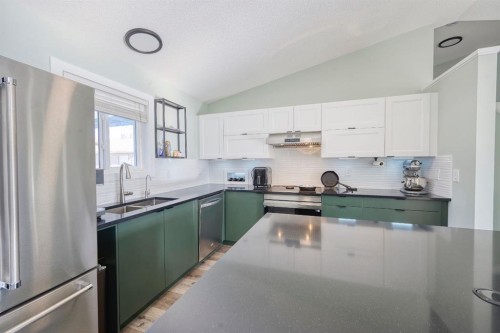 1184 Milt Ford Lane, Carstairs, AB - Indoor Photo Showing Kitchen With Stainless Steel Kitchen With Double Sink With Upgraded Kitchen