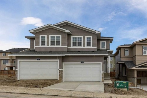 90 Heritage Circle, Cochrane, AB - Outdoor With Facade