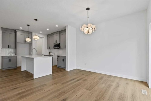 90 Heritage Circle, Cochrane, AB - Indoor Photo Showing Kitchen With Upgraded Kitchen