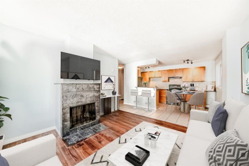 401-823 19 Avenue Sw, Calgary, AB - Indoor Photo Showing Living Room With Fireplace