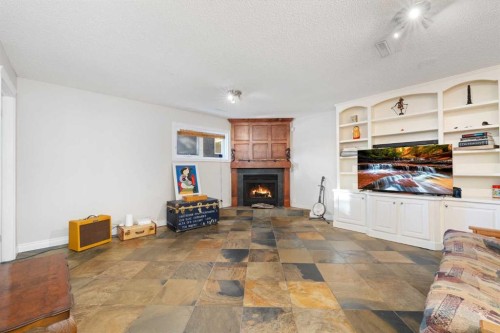 1043 32 Avenue Nw, Calgary, AB - Indoor Photo Showing Living Room With Fireplace