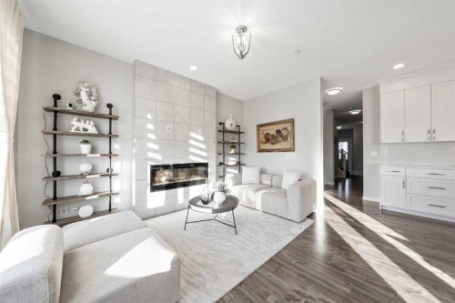 240 Lucas Crescent Nw, Calgary, AB - Indoor Photo Showing Living Room With Fireplace