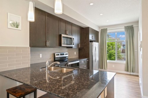 19640 40 Street Se, Calgary, AB - Indoor Photo Showing Kitchen With Stainless Steel Kitchen With Double Sink With Upgraded Kitchen