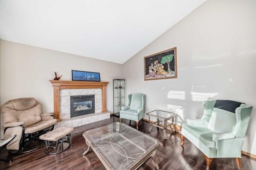 61 Royal Birch Grove Nw, Calgary, AB - Indoor Photo Showing Living Room With Fireplace