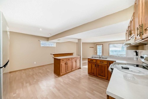 61 Royal Birch Grove Nw, Calgary, AB - Indoor Photo Showing Kitchen With Double Sink