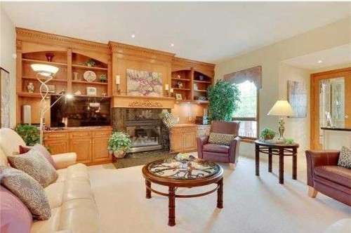 175 Pumpvalley Court Sw, Calgary, AB - Indoor Photo Showing Living Room With Fireplace