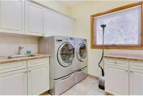 175 Pumpvalley Court Sw, Calgary, AB - Indoor Photo Showing Laundry Room