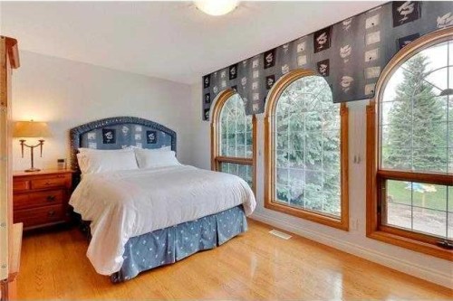 175 Pumpvalley Court Sw, Calgary, AB - Indoor Photo Showing Bedroom