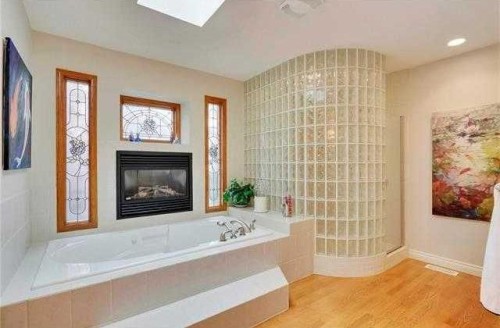 175 Pumpvalley Court Sw, Calgary, AB - Indoor Photo Showing Bathroom With Fireplace