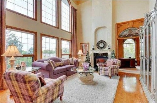 175 Pumpvalley Court Sw, Calgary, AB - Indoor Photo Showing Living Room With Fireplace