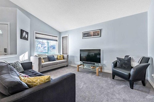 63 Bridlecreek Terrace Sw, Calgary, AB - Indoor Photo Showing Living Room