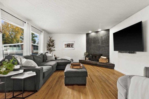 5231 Sheldon Place Nw, Calgary, AB - Indoor Photo Showing Living Room With Fireplace