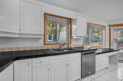 13895 Evergreen Street Sw, Calgary, AB - Indoor Photo Showing Kitchen With Double Sink