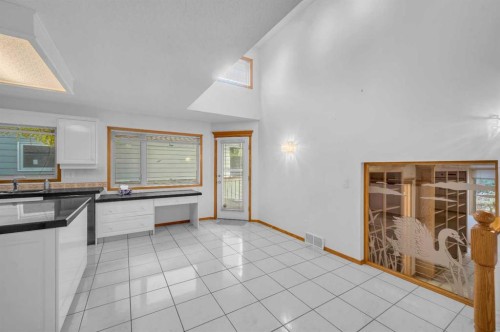 13895 Evergreen Street Sw, Calgary, AB - Indoor Photo Showing Kitchen With Double Sink