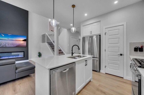 3021 Key Drive Sw, Airdrie, AB - Indoor Photo Showing Kitchen With Double Sink With Upgraded Kitchen