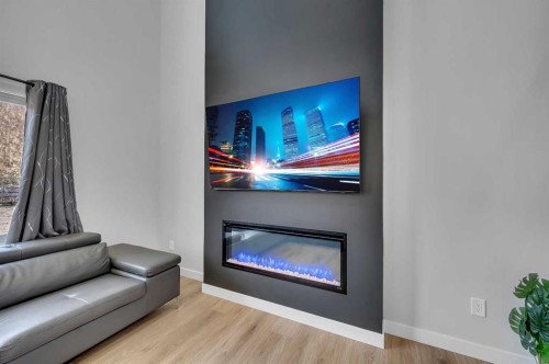 3021 Key Drive Sw, Airdrie, AB - Indoor Photo Showing Living Room With Fireplace