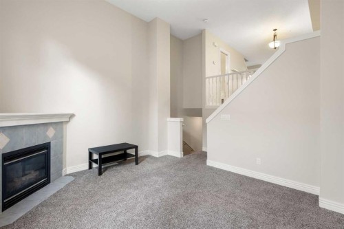 225 Bridlewood Lane Sw, Calgary, AB - Indoor With Fireplace
