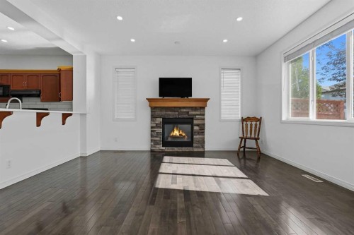 45 Everglen Crescent Sw, Calgary, AB - Indoor Photo Showing Living Room With Fireplace