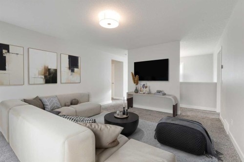 57 Magnolia Heath Se, Calgary, AB - Indoor Photo Showing Living Room