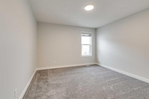 57 Magnolia Heath Se, Calgary, AB - Indoor Photo Showing Other Room