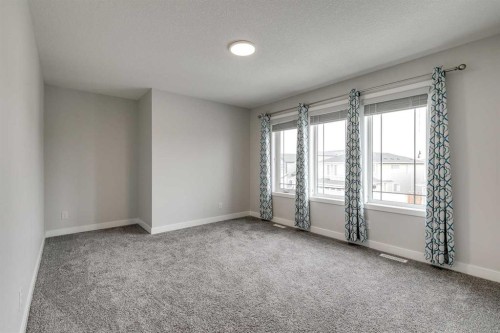 57 Magnolia Heath Se, Calgary, AB - Indoor Photo Showing Other Room