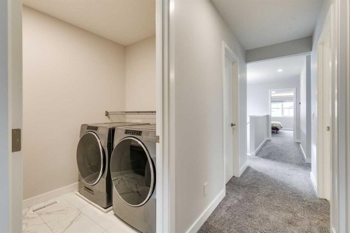 57 Magnolia Heath Se, Calgary, AB - Indoor Photo Showing Laundry Room