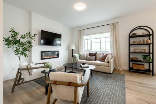 506 Ranch Green, Strathmore, AB - Indoor Photo Showing Living Room With Fireplace