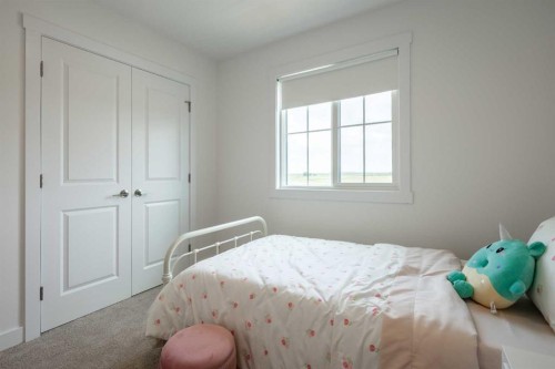 506 Ranch Green, Strathmore, AB - Indoor Photo Showing Bedroom