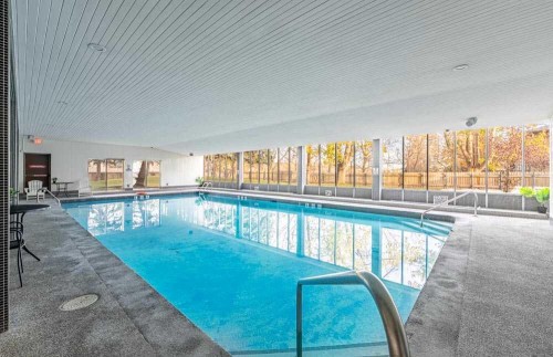 1709-4944 Dalton Drive Nw, Calgary, AB - Outdoor With In Ground Pool