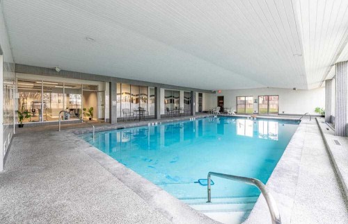 1709-4944 Dalton Drive Nw, Calgary, AB - Indoor Photo Showing Other Room With In Ground Pool