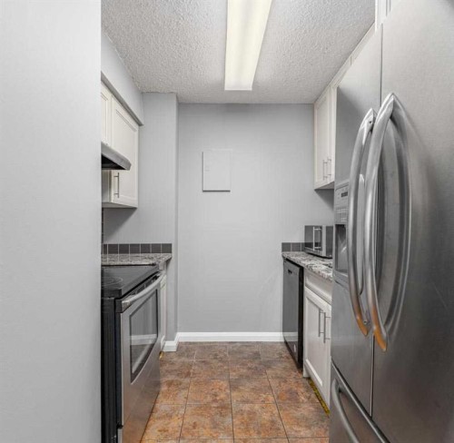 1709-4944 Dalton Drive Nw, Calgary, AB - Indoor Photo Showing Kitchen