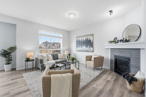 1096 Hillcrest Lane Sw, Airdrie, AB - Indoor Photo Showing Living Room With Fireplace