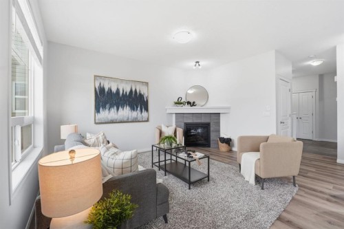 1096 Hillcrest Lane Sw, Airdrie, AB - Indoor Photo Showing Living Room With Fireplace