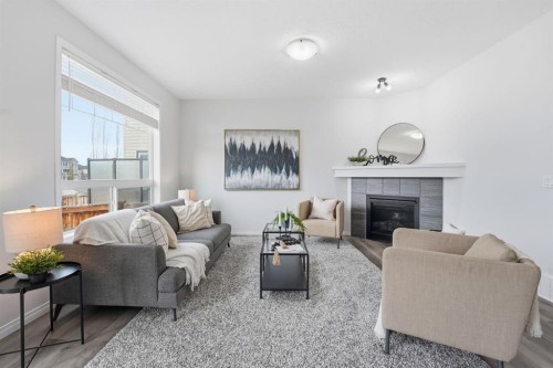 1096 Hillcrest Lane Sw, Airdrie, AB - Indoor Photo Showing Living Room With Fireplace
