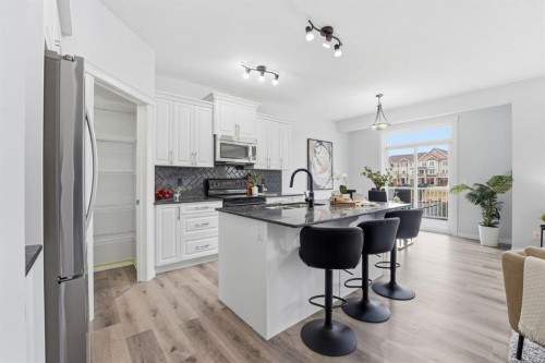 1096 Hillcrest Lane Sw, Airdrie, AB - Indoor Photo Showing Kitchen With Upgraded Kitchen