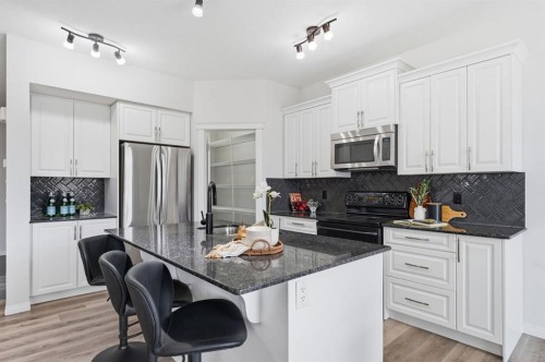 1096 Hillcrest Lane Sw, Airdrie, AB - Indoor Photo Showing Kitchen With Upgraded Kitchen