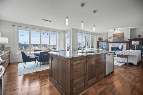 51 Cimarron Springs Circle, Okotoks, AB - Indoor Photo Showing Kitchen With Fireplace With Upgraded Kitchen