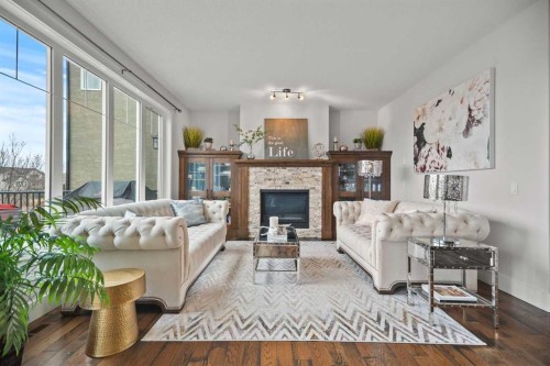 51 Cimarron Springs Circle, Okotoks, AB - Indoor Photo Showing Living Room With Fireplace