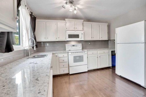 4764 Rundlewood Drive Ne, Calgary, AB - Indoor Photo Showing Kitchen With Double Sink