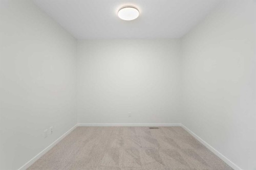 135 Creekview Gardens Sw, Calgary, AB - Indoor Photo Showing Other Room