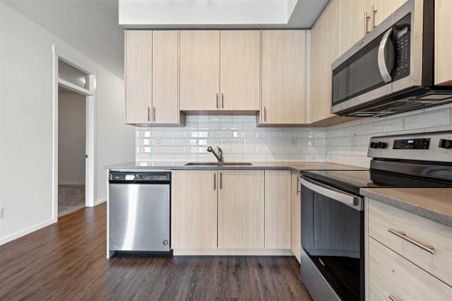 6318-151 Legacy Main Street Se, Calgary, AB - Indoor Photo Showing Kitchen With Stainless Steel Kitchen With Upgraded Kitchen