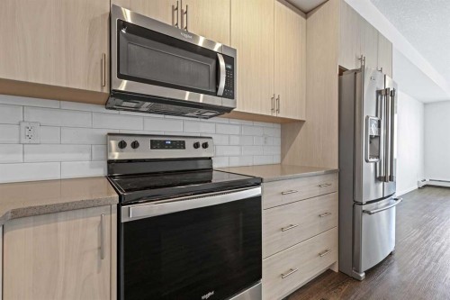 6318-151 Legacy Main Street Se, Calgary, AB - Indoor Photo Showing Kitchen With Stainless Steel Kitchen With Upgraded Kitchen
